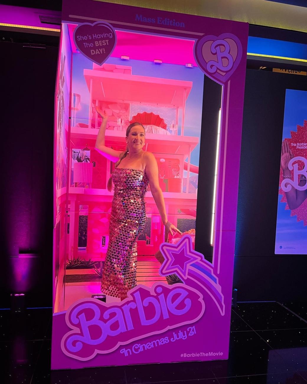 Kayla Carpenter, Manager of Global Brand Marketing for the Barbie brand at Mattel poses in a lifesize Barbie box.