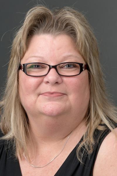 Deb Sellers in a black sleeveless shirt