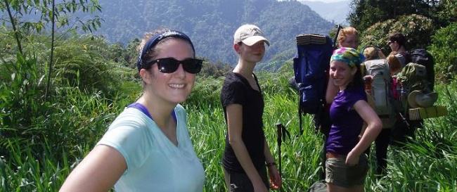 Students smile while they hike in the mountains of Costa Rica