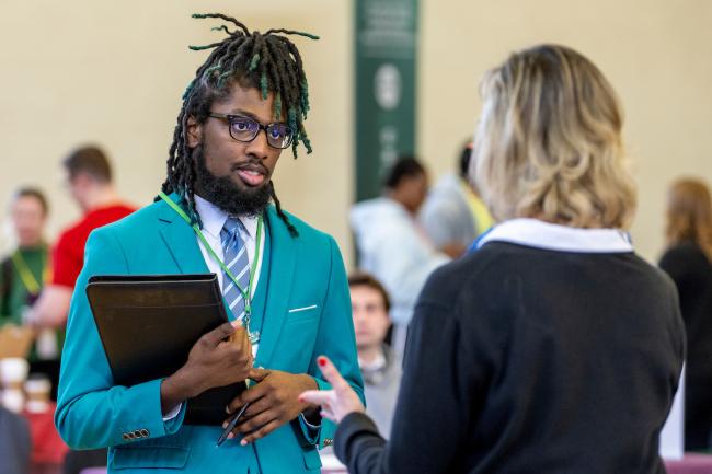 Students and employers at a Career Fair in OHIO's Baker Ballroom