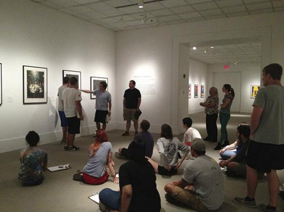 Class tour observing portraits