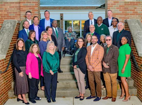 OUAA Board of Directors group photo on stairs of OU Inn.