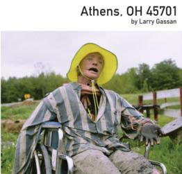 Dummy set up in a wheelchair wearing striped shirt and yellow hat.