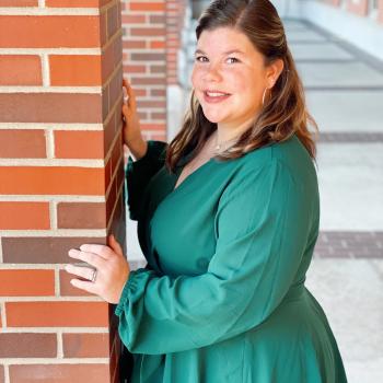 Student Brooke Kelley in a green dress