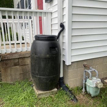 Rain barrel outside of the ecohouse