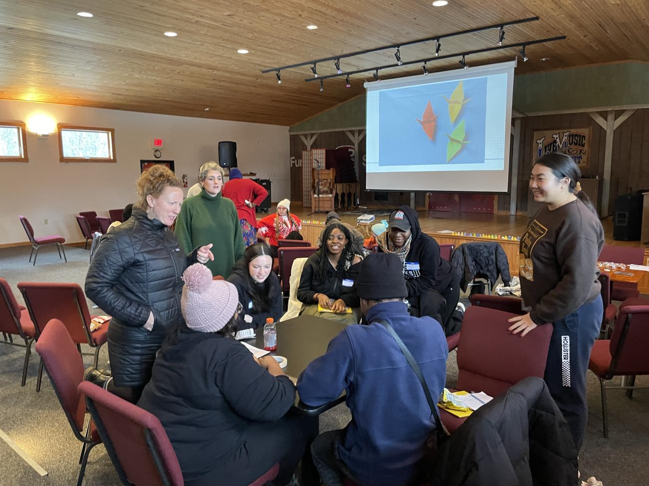 people talking around a table during a workshop presentation 