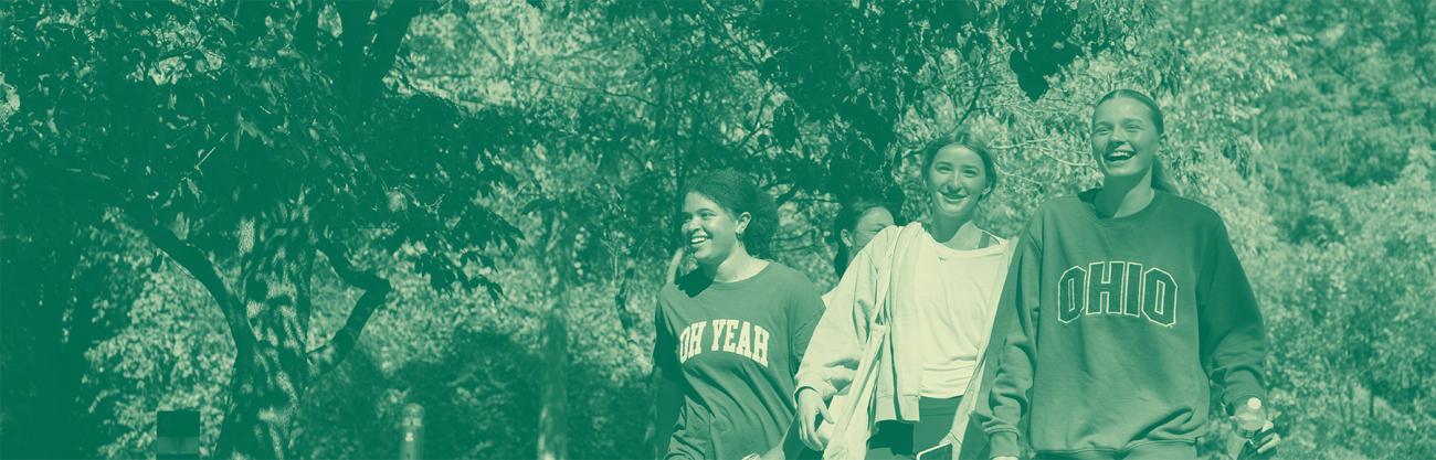 three OHIO students walking on Ohio University's beautiful campus