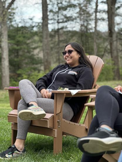 a student sitting in a chair during a well-being network meeting