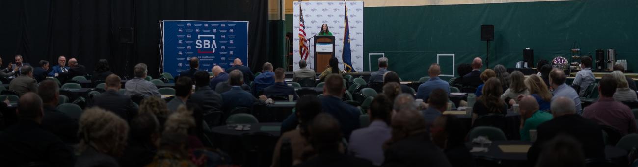 conference audience with speaker at podium