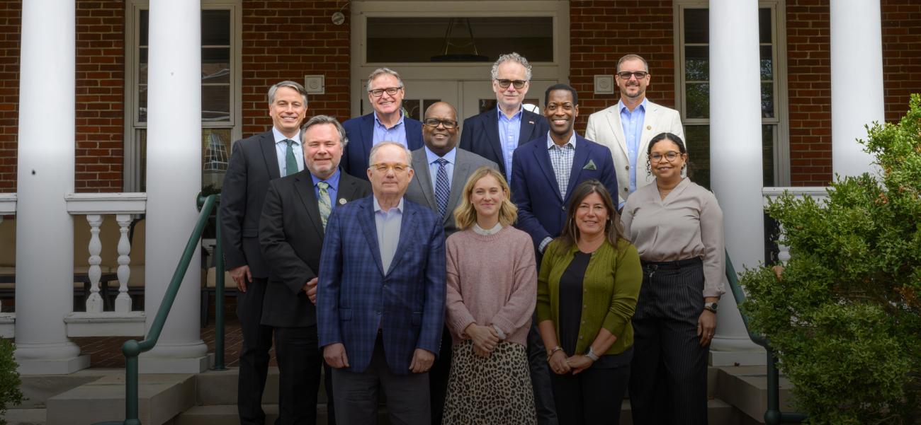 deans advisory board standing on steps together