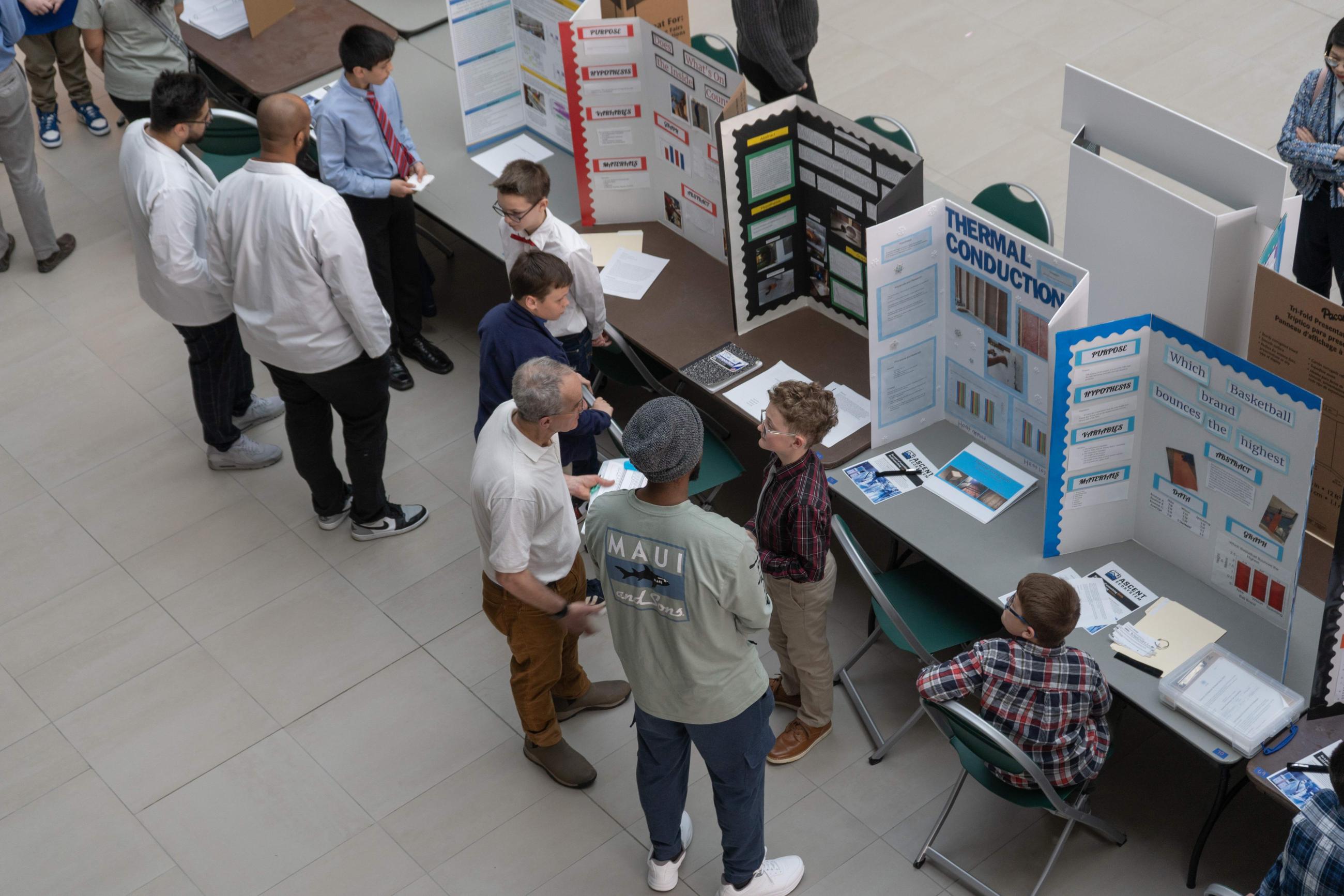 Judge viewing student's science display