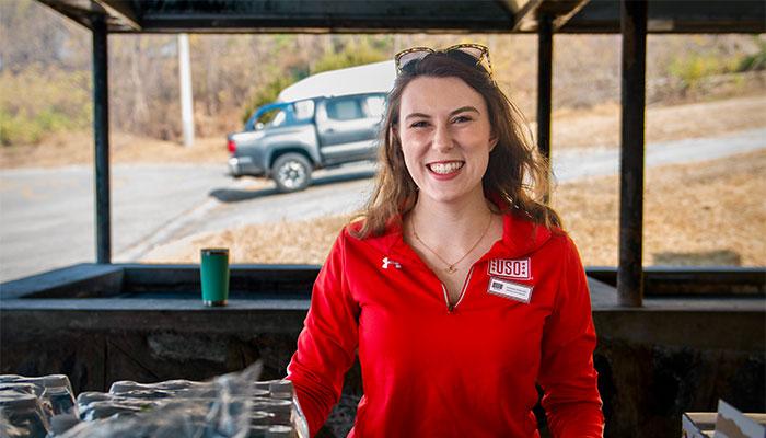Shannon Hamelund in tent at USO event