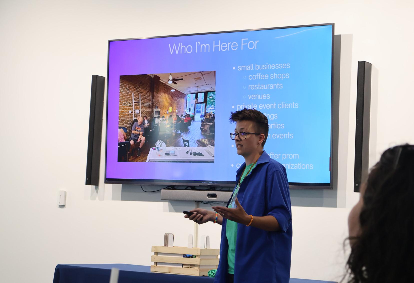 A Pitch competition contestant presents their idea to the committee.