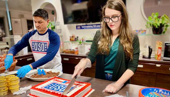 Cake being cut at USO event